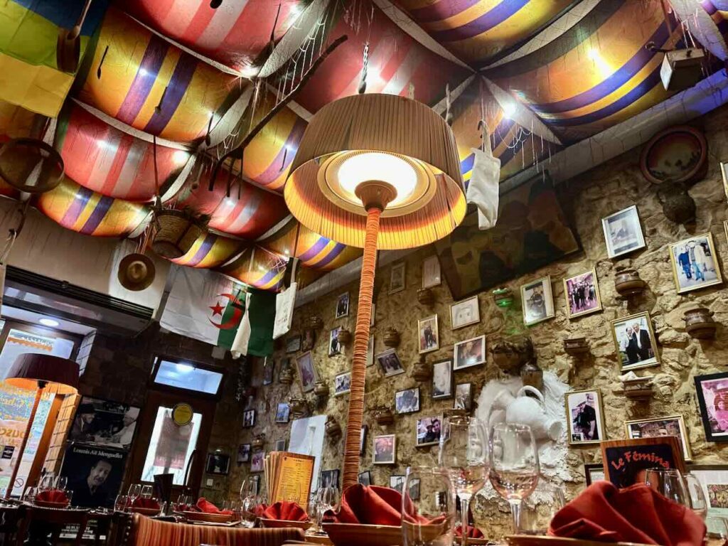 Le Femina est un restaurant de couscous Kabyle situé dans le quartier de Noailles à Marseille. Avec de la semoule de blé ou d'orge, le couscous y est préparé dans les règles de l'art par la famille Kachetel de génération en génération depuis plus d'un siècle (lampe)